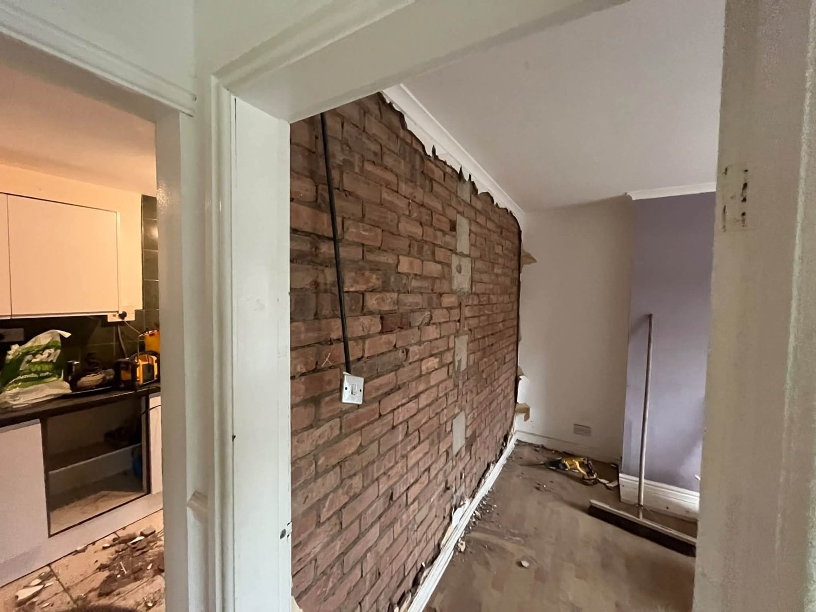 Internal wall being opened up between rooms
