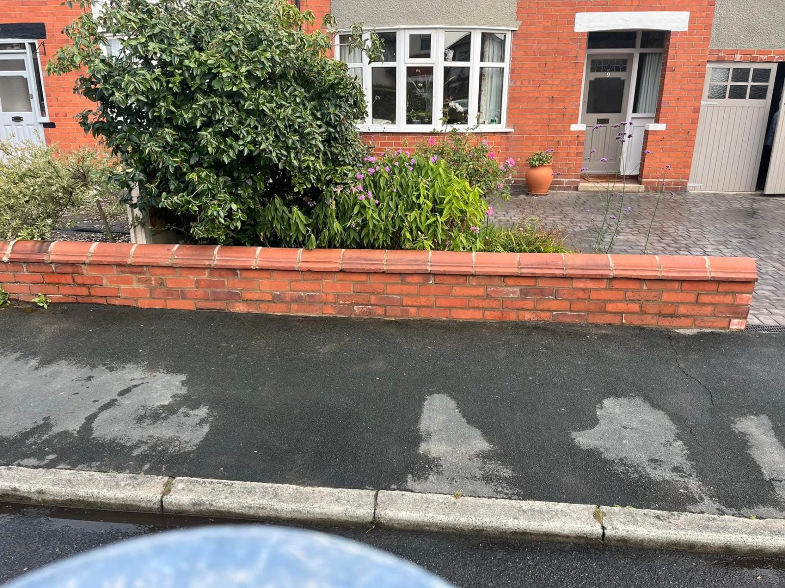 New front garden wall in red brick with coping