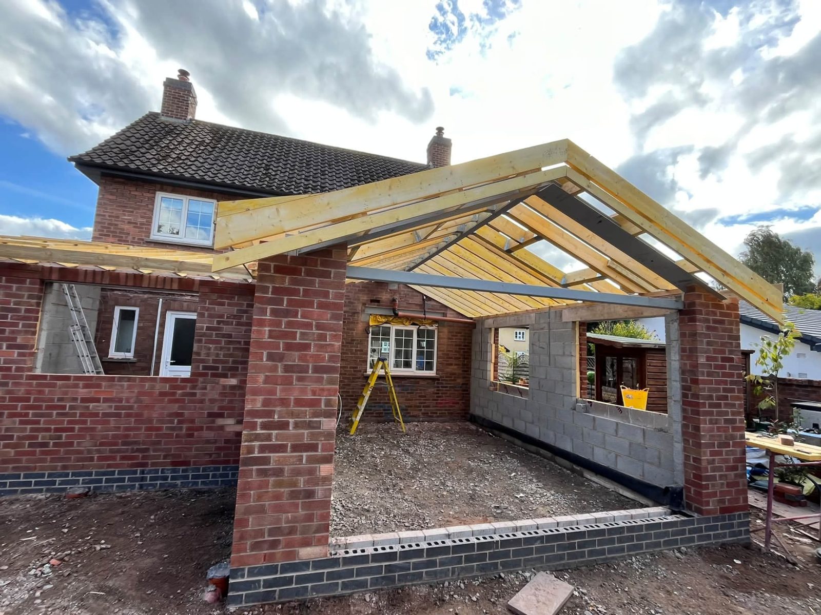 Pitched roof frame on a brick extension
