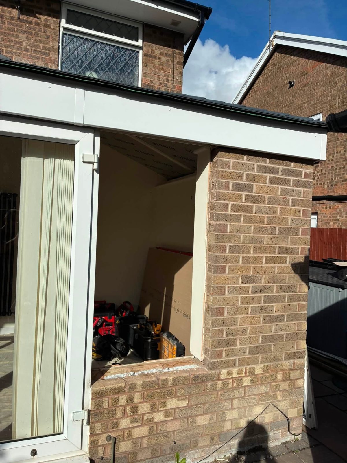 Extension walls being built in buff facing brick