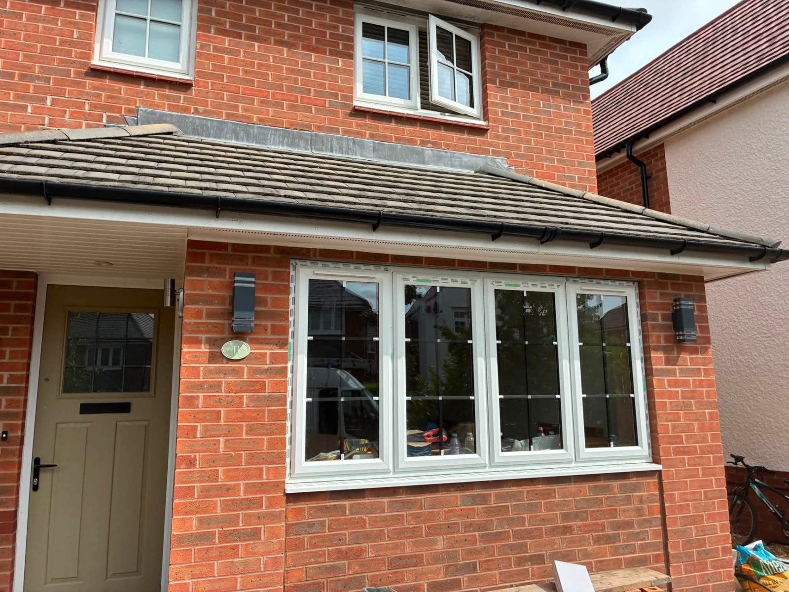 Front elevation brickwork with new door and bay window